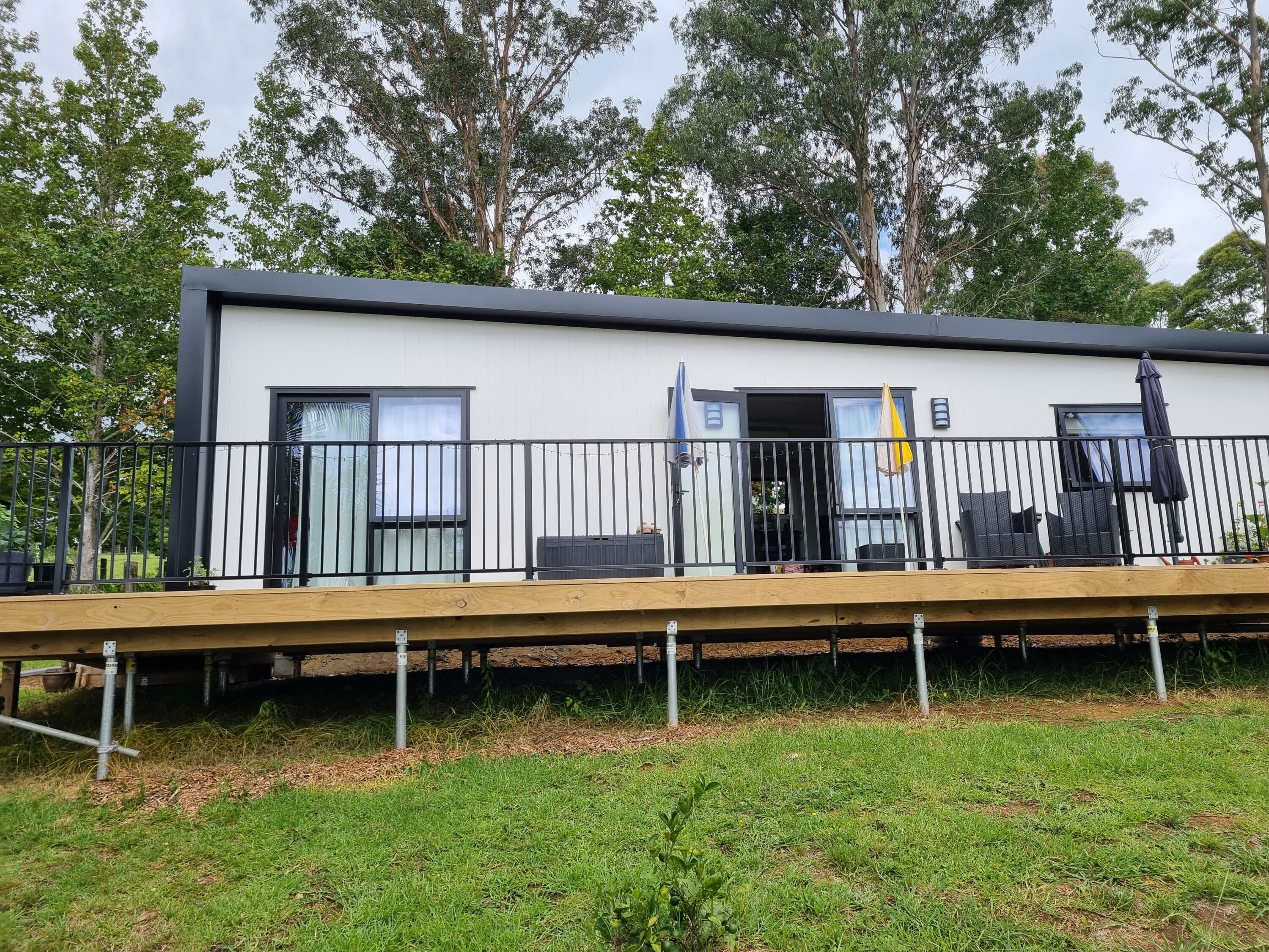 completed home with deck and handrail