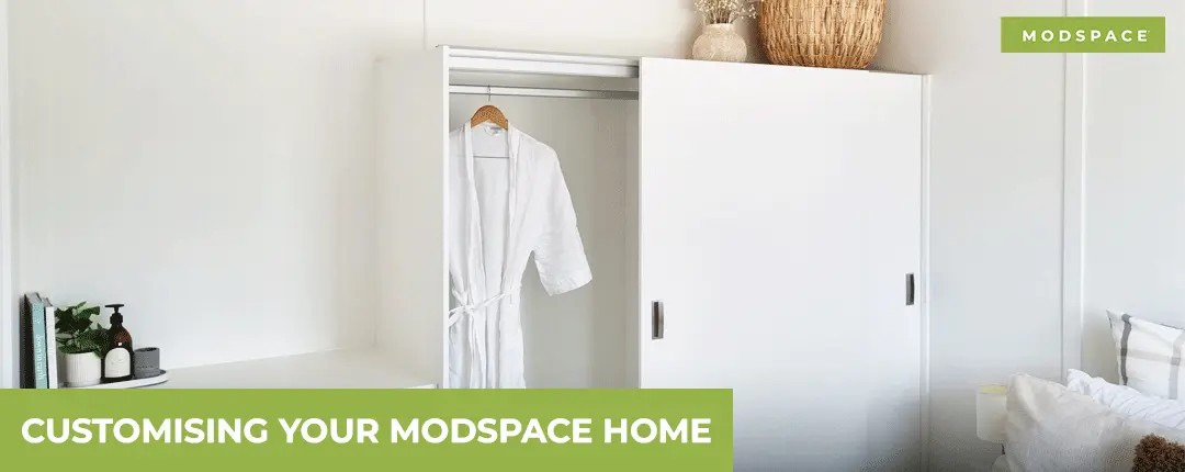 Built-in white bedroom wardrobe with sliding doors, featuring customisable interior house designs in NZ.